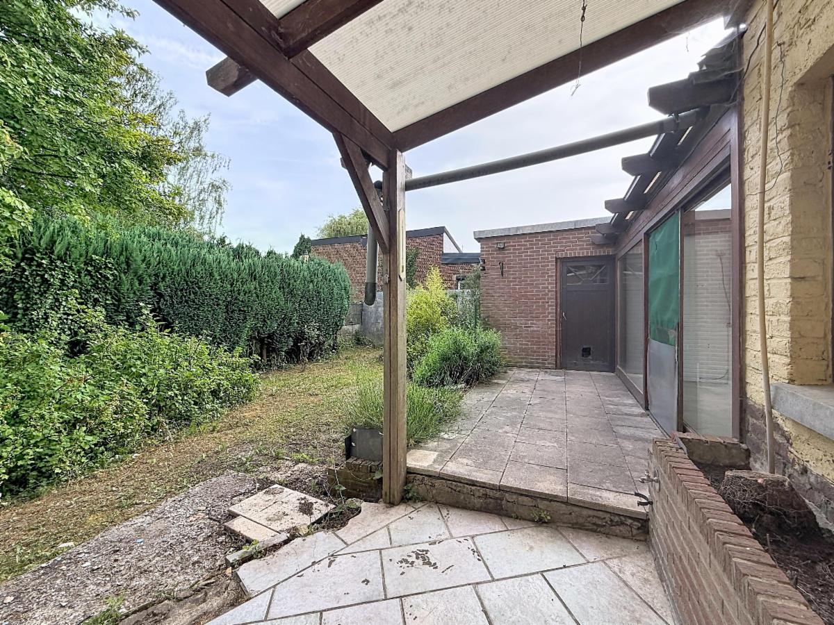 photo 15 du bien Spacieuse maison à rénover avec double garage et jardin !